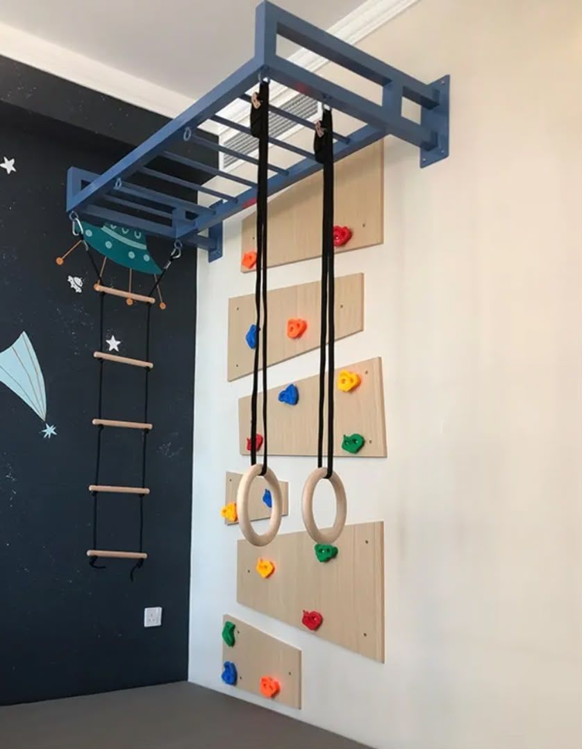 Space themed climbing and monkey bar wall